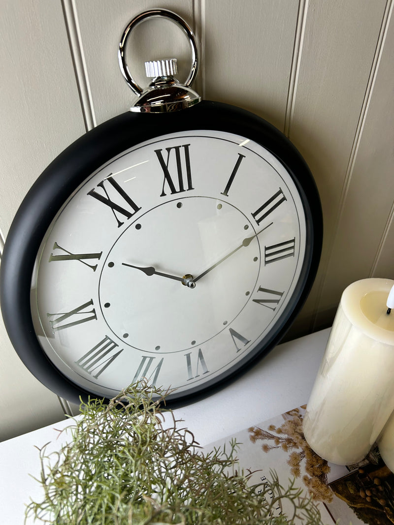 Black and silver fob wall clock