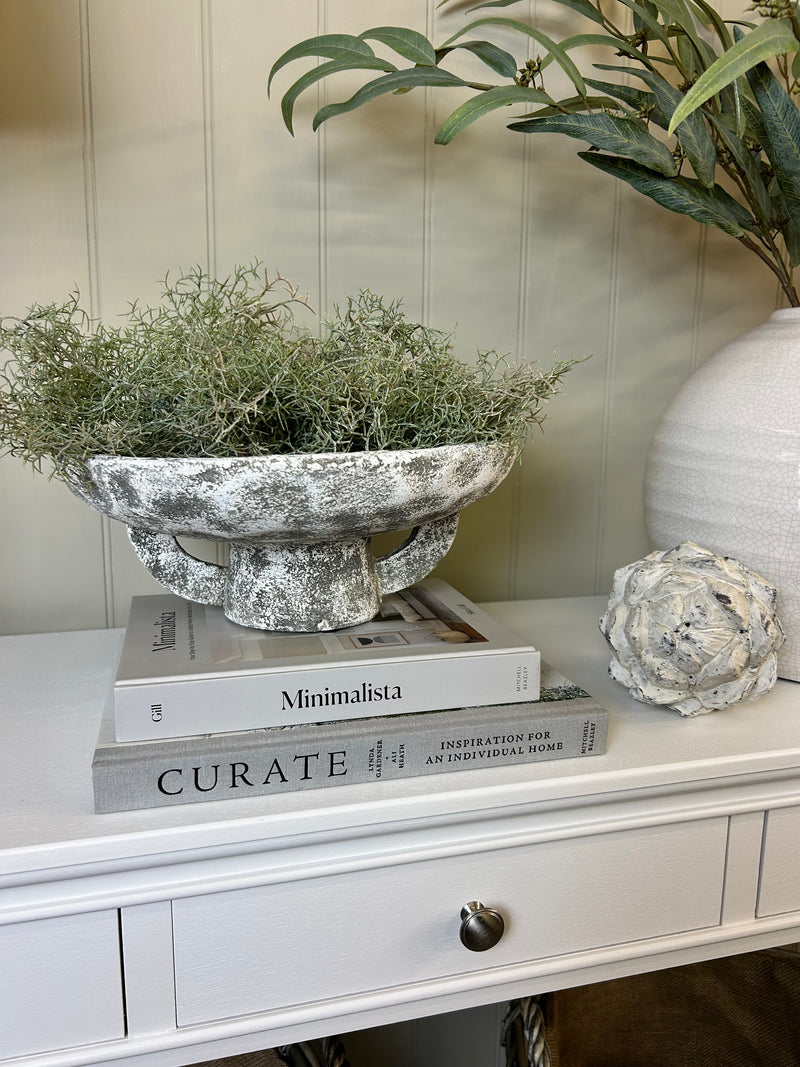 Round rustic stone bowl on foot base