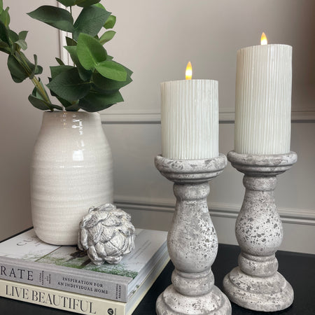 Set of two stone candle sticks