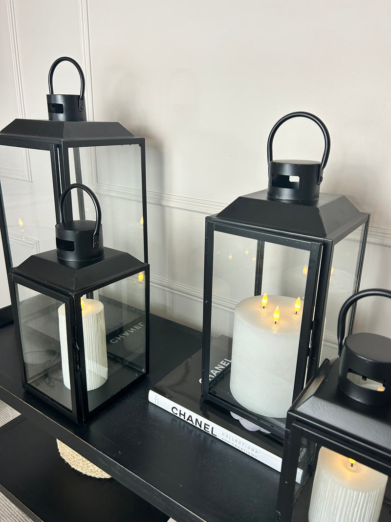 Black metal lanterns top