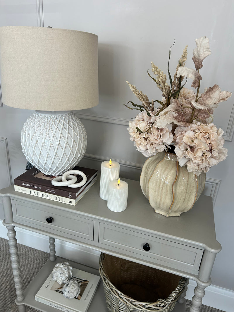 Neutral taupe console table with textured beaded legs