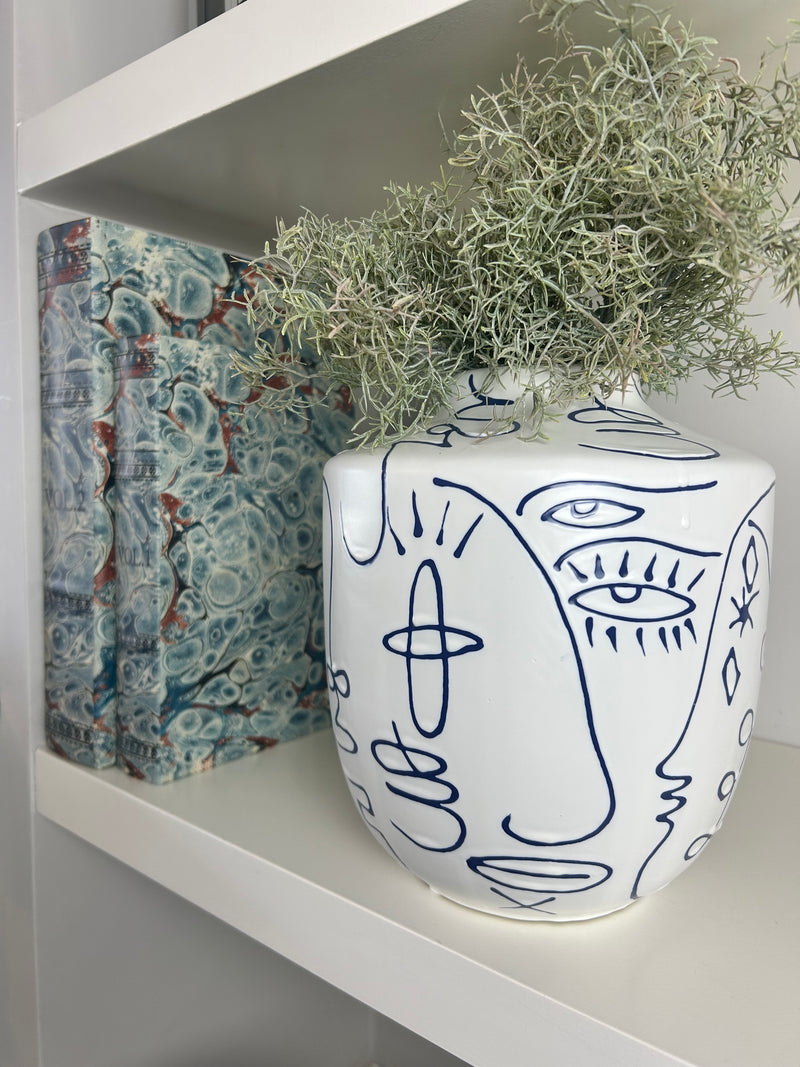 Medium white blue face faces vase