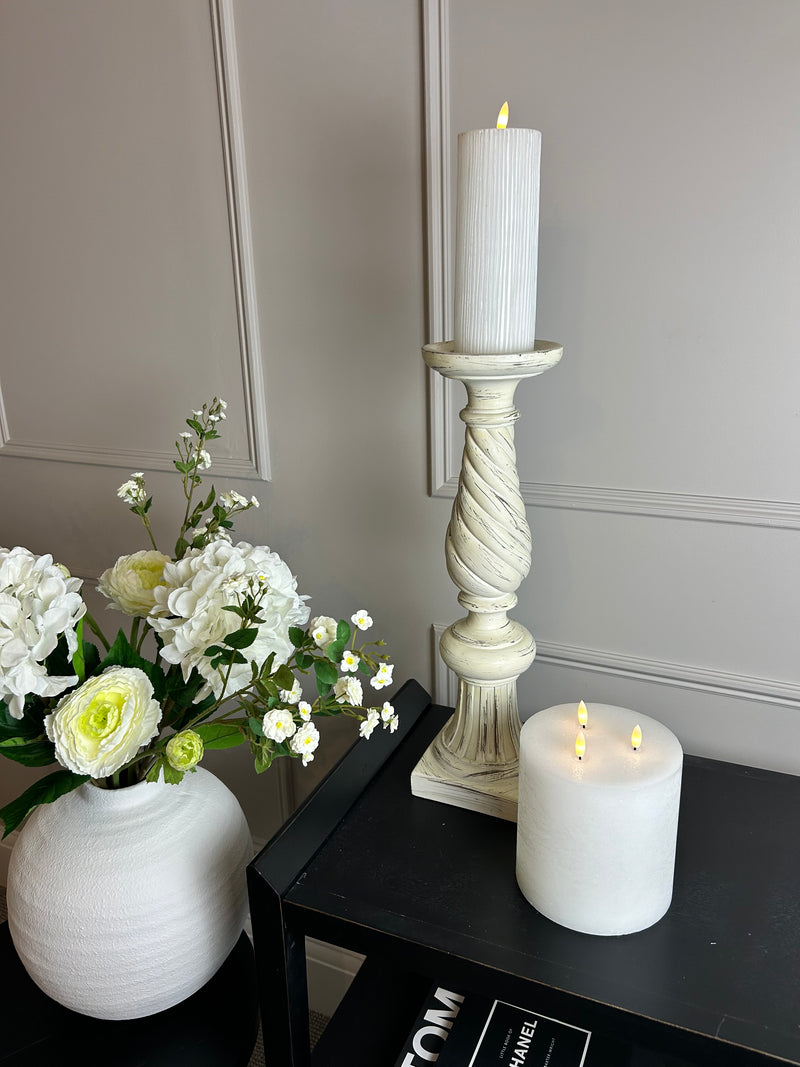 Pair of cream large twisted candle sticks