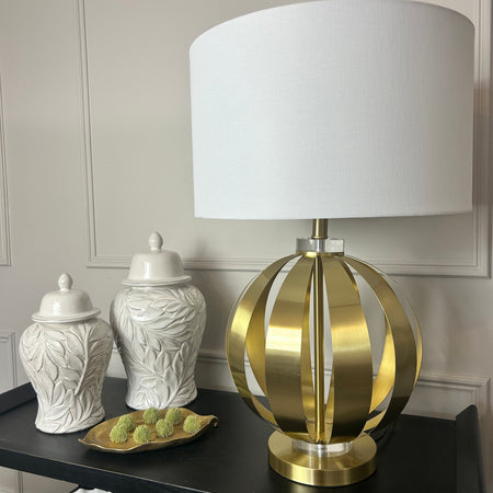 Gold metal round chunky lamp with white shade