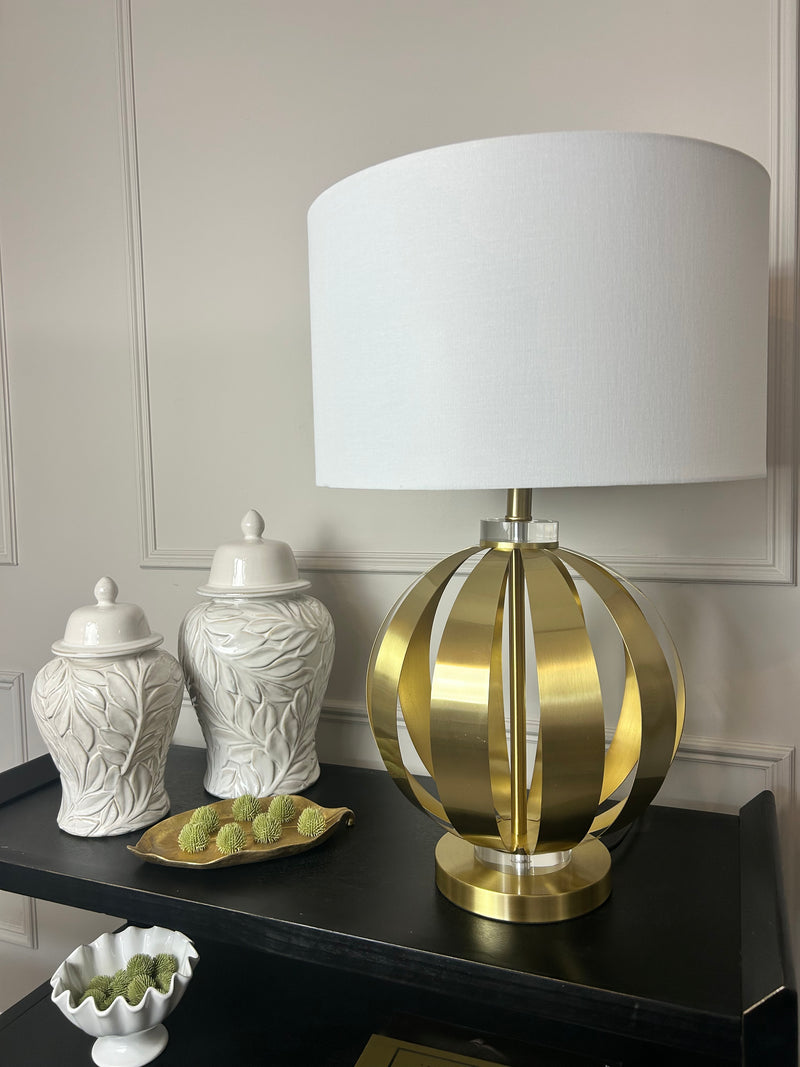 Gold metal round chunky lamp with white shade