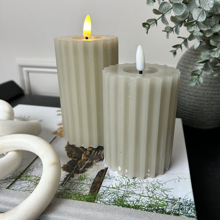 Pale taupe grey LED ribbed candle with timer two sizes