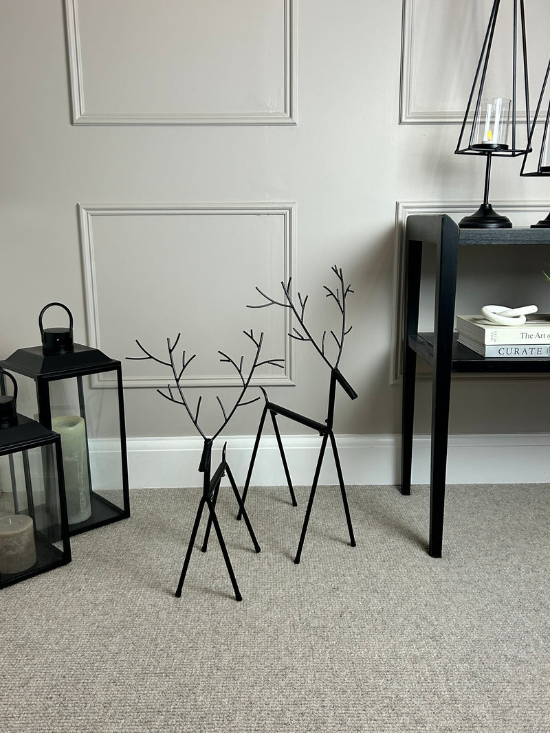 Set of two black metal reindeers 67cm