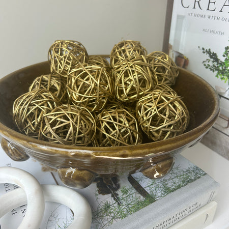 Woven gold balls in bag