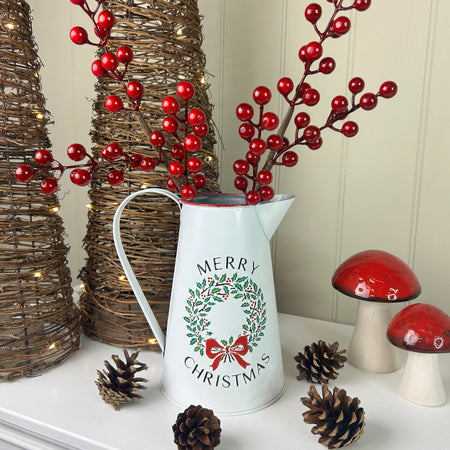 Metal jug with wreath detail