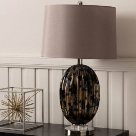 Black and gold glass lamp with taupe shade
