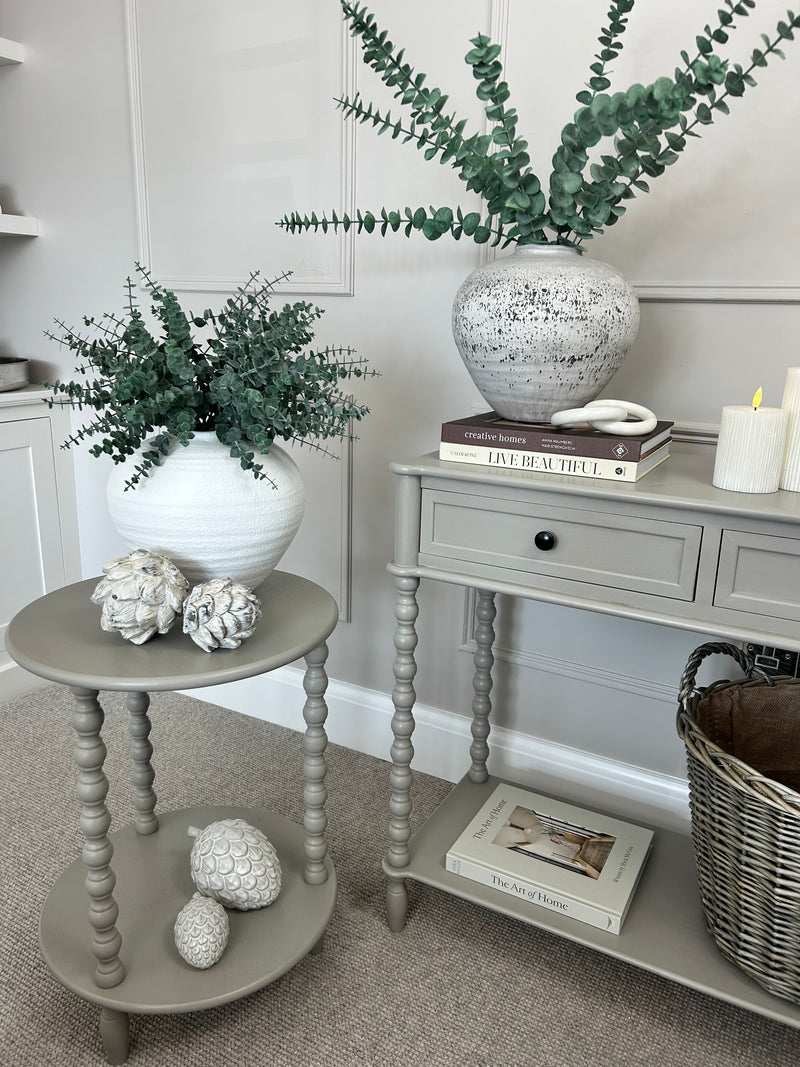 Neutral taupe console table with textured beaded legs