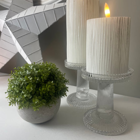 Pair of ribbed glass candle holders