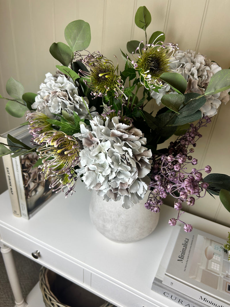 Green and purple protea stem head