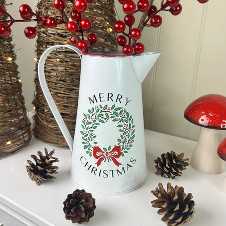 Metal jug with wreath detail