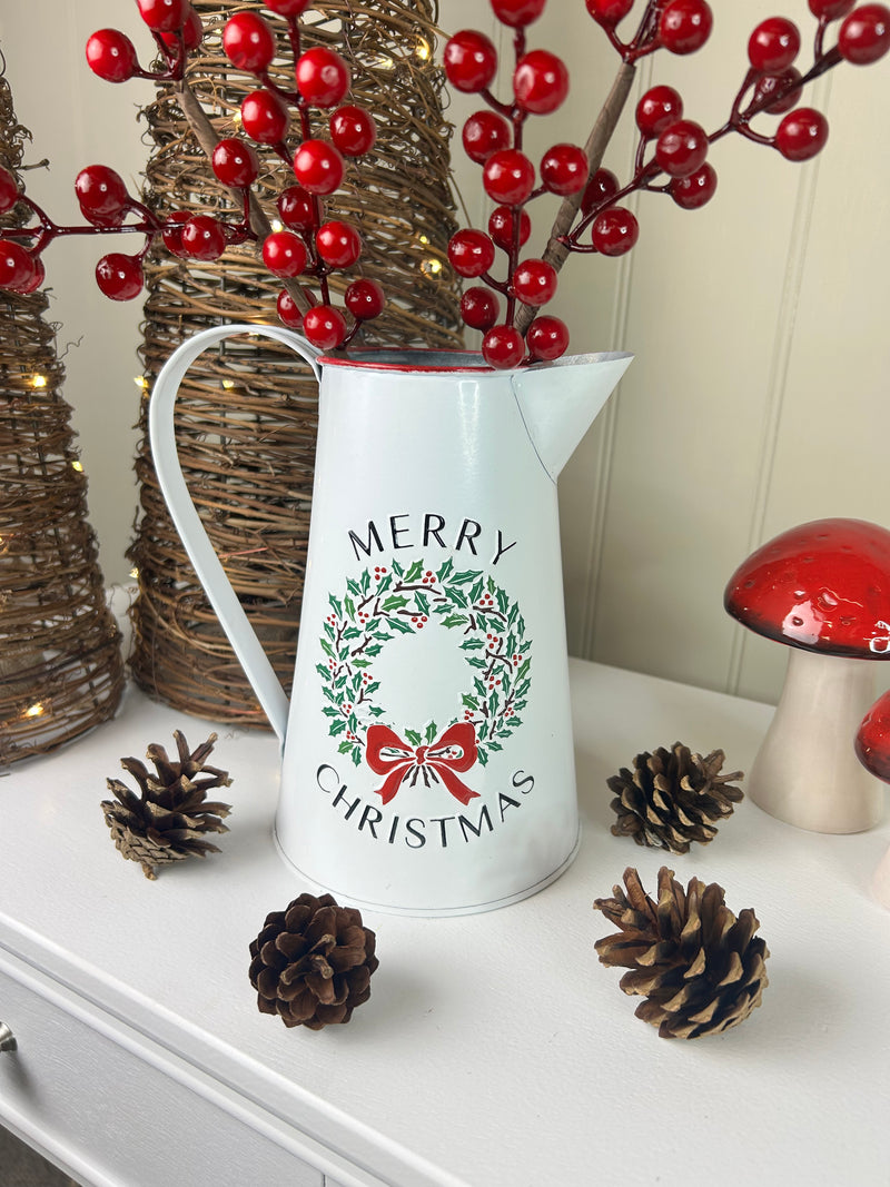 Metal jug with wreath detail