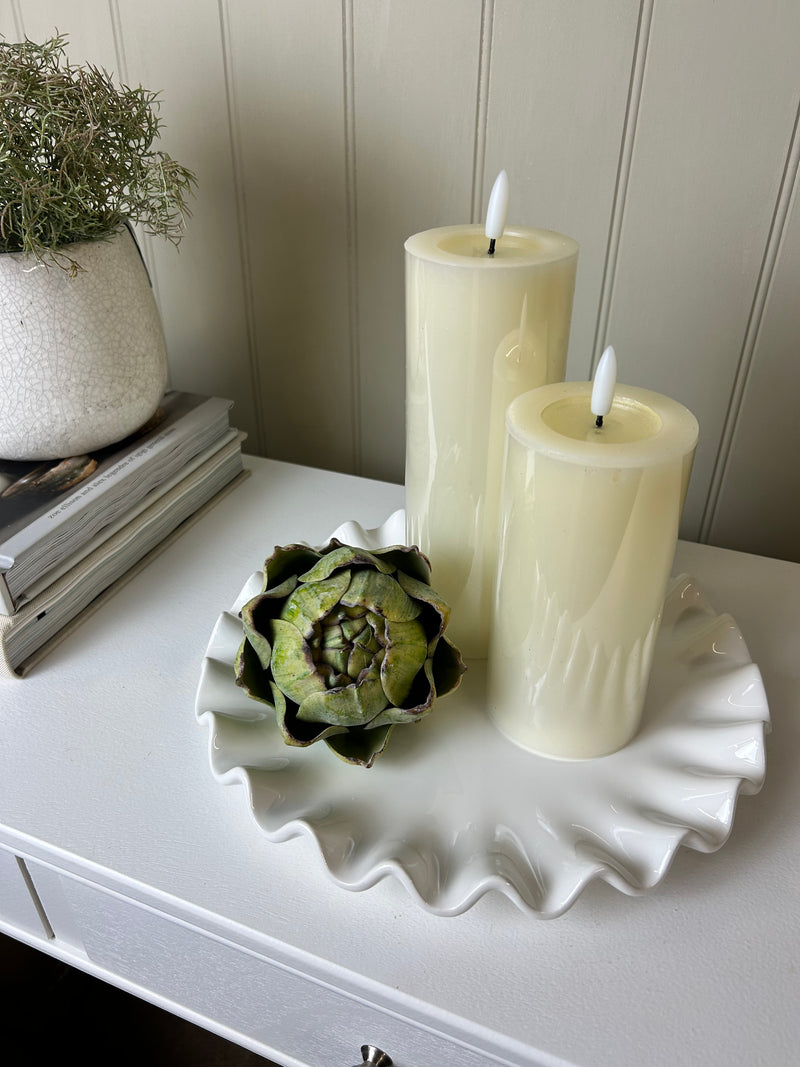 Ruffled white ceramic candle plate