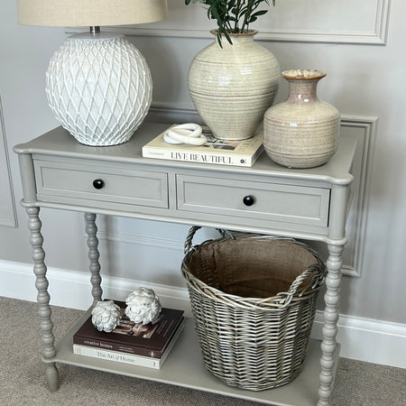 Neutral taupe console table with textured beaded legs