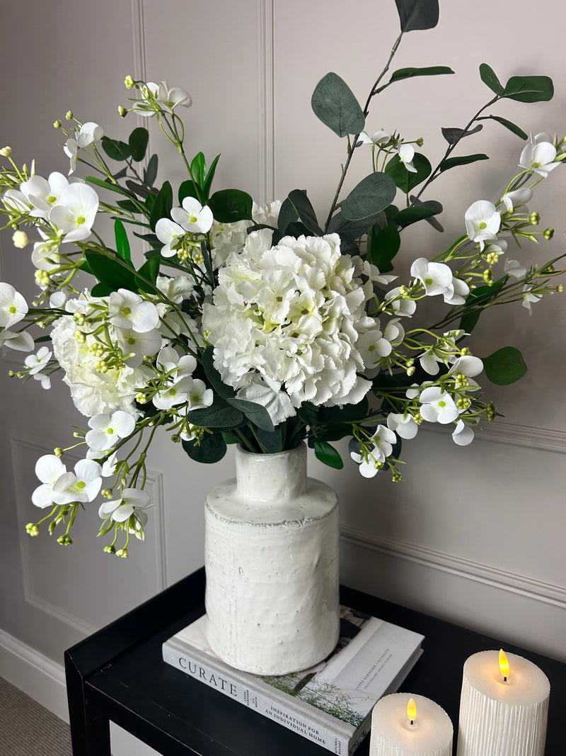 Eucalyptus, white hydrangeas and Florence spray stem arrangement