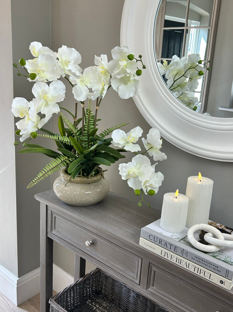 White vanda orchid in ceramic planter pot
