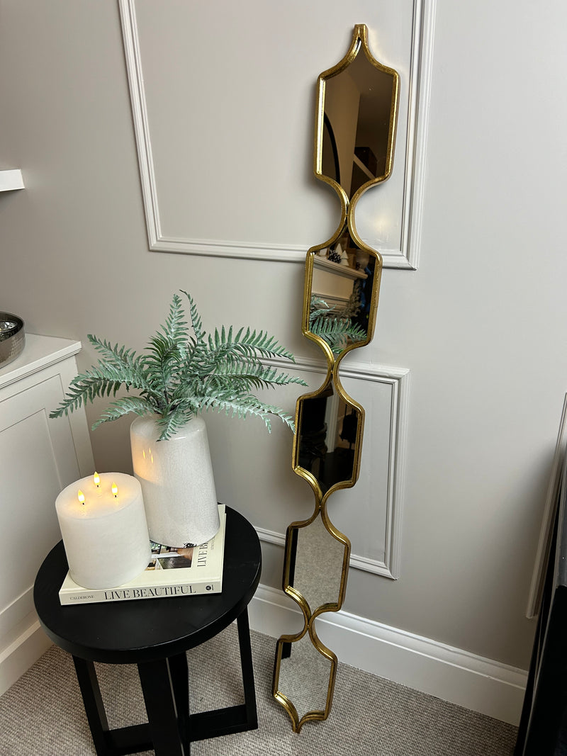 Tall slim gold decorative mirror