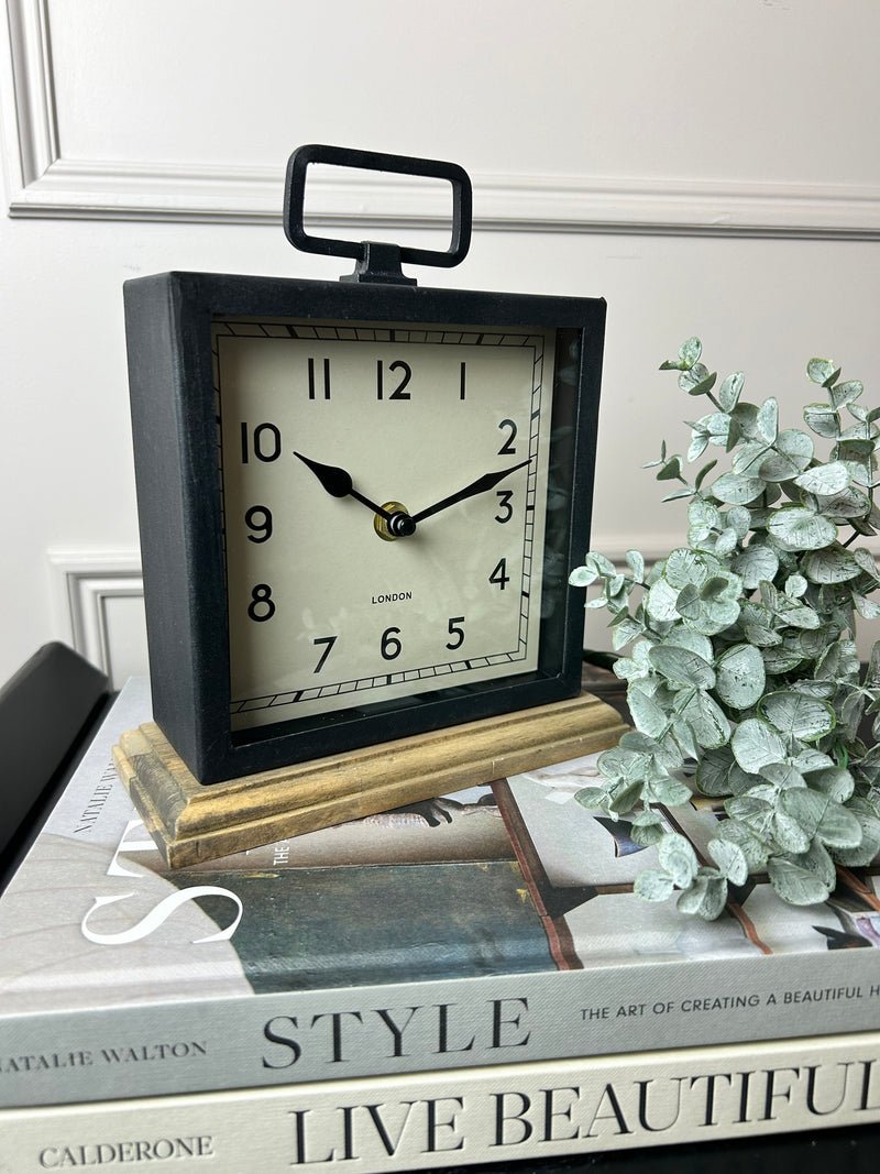 Black wooden based metal clock
