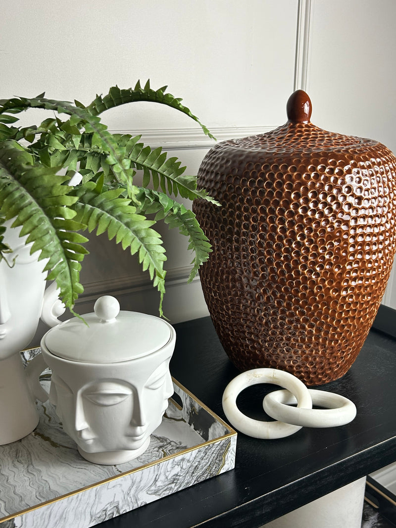Burnt orange bobble pitted hammered ceramic lidded vase jar
