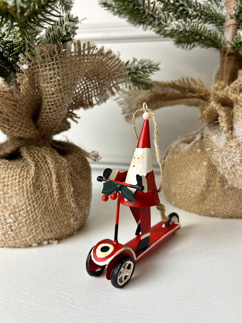Traditional Metal Santa on scooter