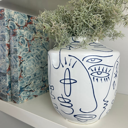 Medium white blue face faces vase