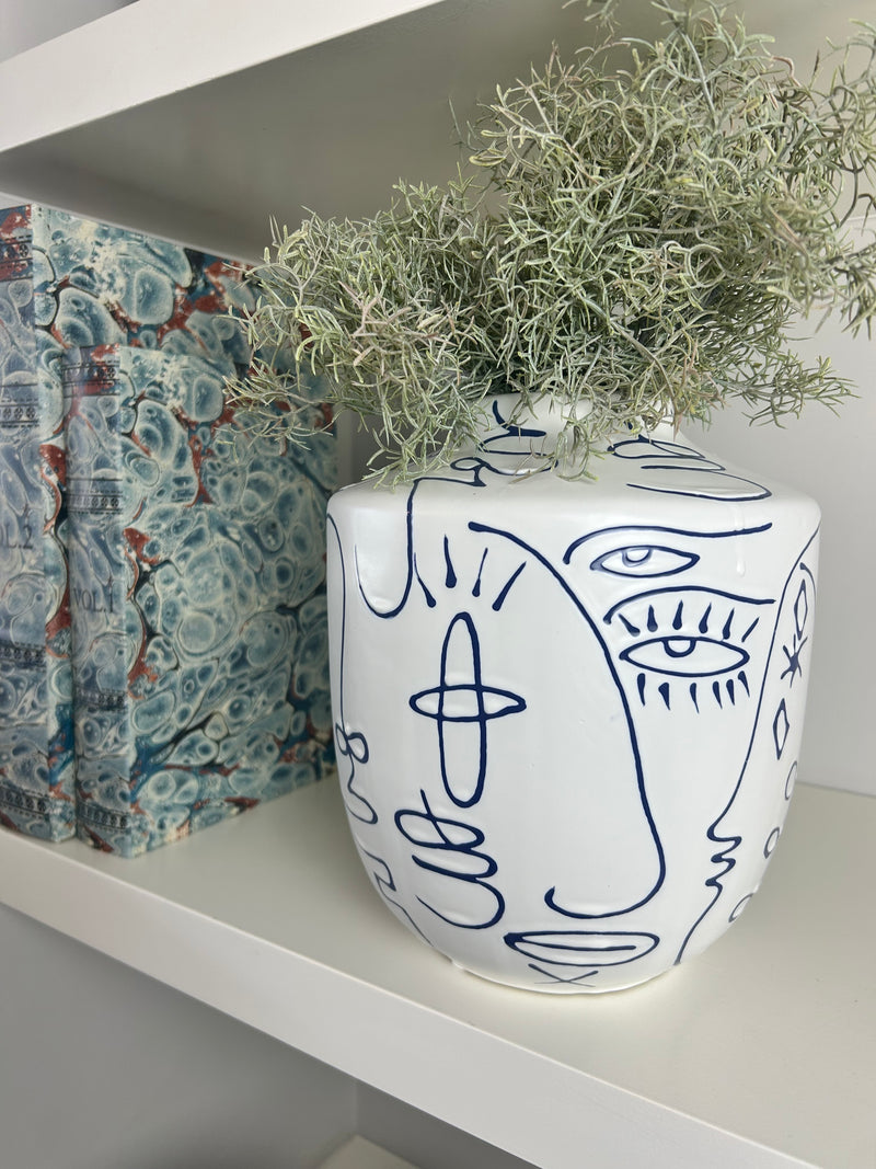 Medium white blue face faces vase