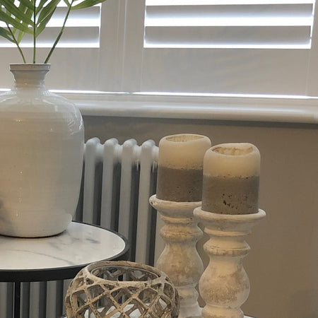 Pair of small stone candlesticks