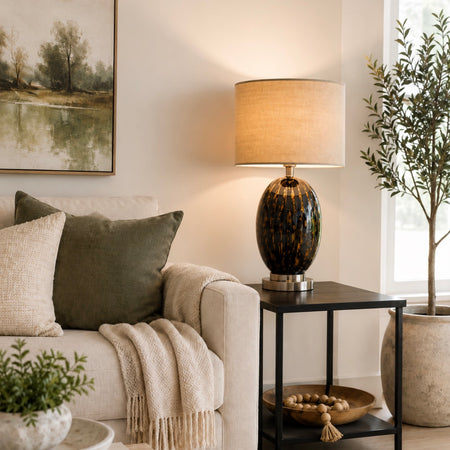 Black and gold glass lamp with taupe shade