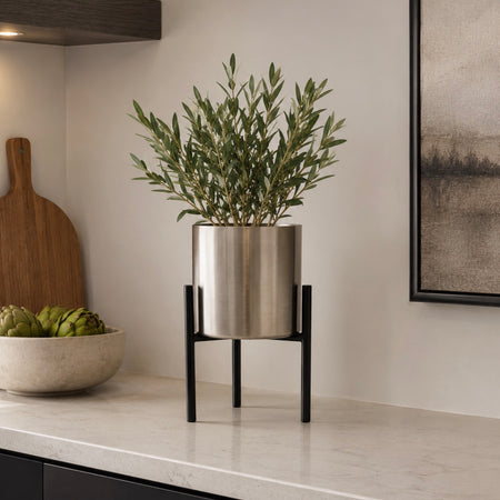 Chrome silver plant pot on black stand