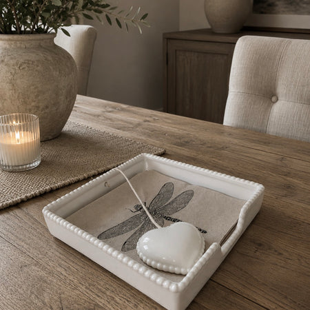 White ceramic napkin holder with weight