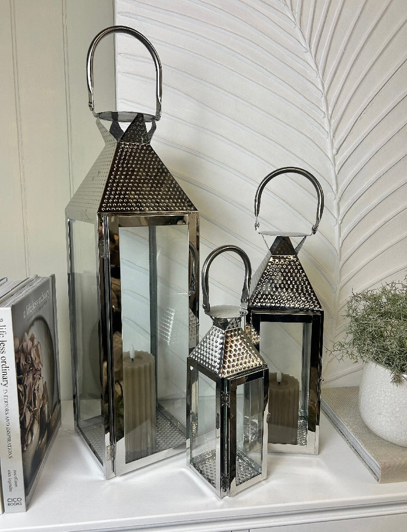 Black round mirror with gold accent and fob detail