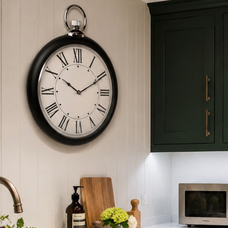 Black and silver fob wall clock