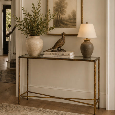 Antique gold textured metal glass top console table