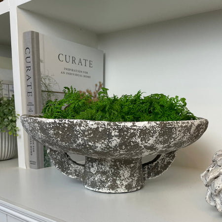Round rustic stone bowl on foot base