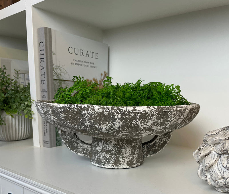 Round rustic stone bowl on foot base