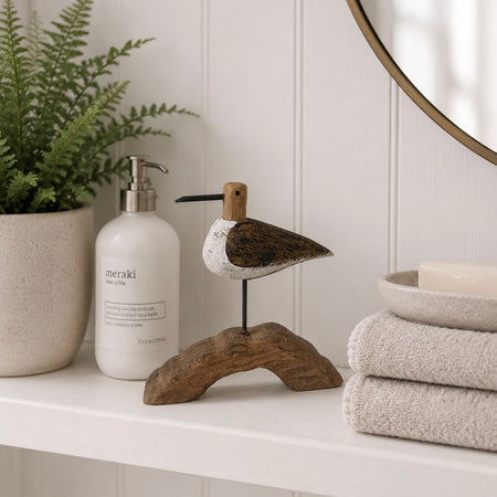Small bird on plinth 10cm