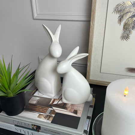 White ceramic hugging rabbits