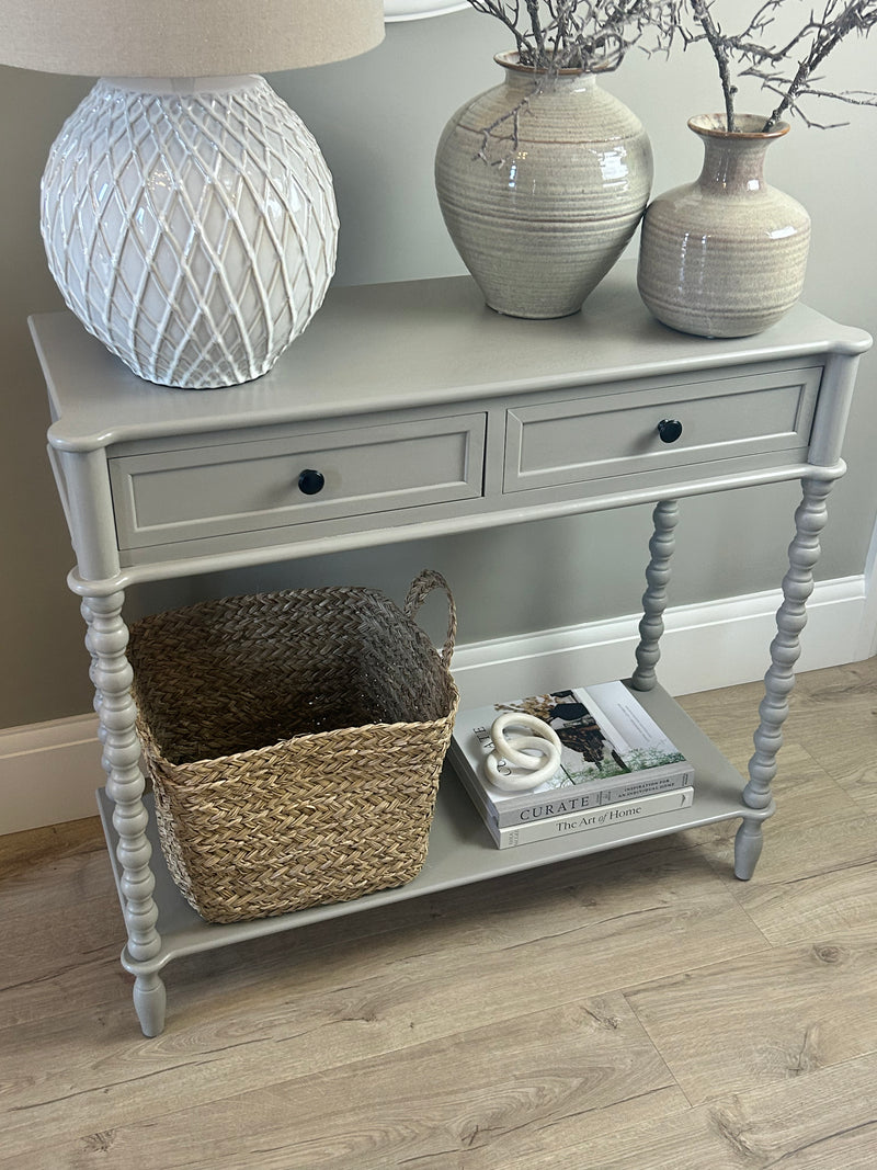 Neutral taupe console table with textured beaded legs