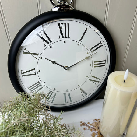 Black and silver fob wall clock