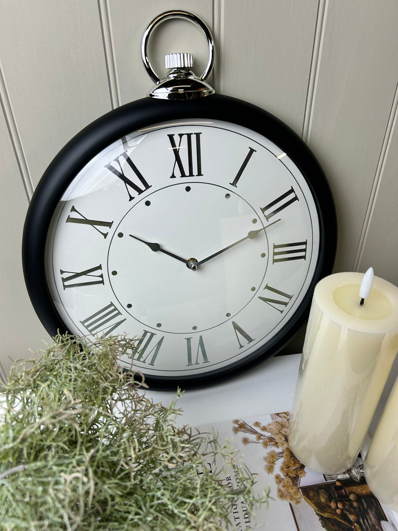 Black and silver fob wall clock