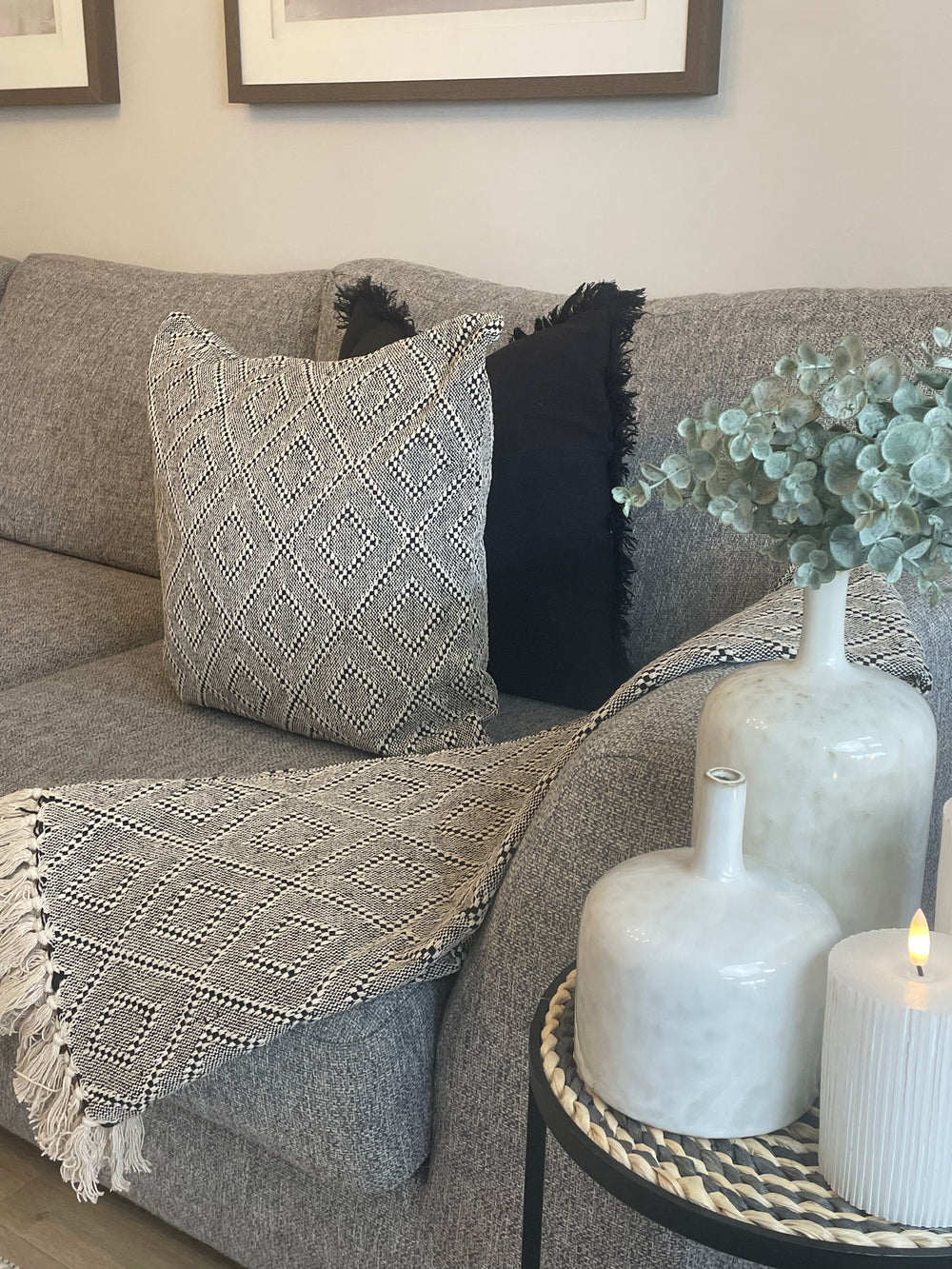 Cream cushions top on grey sofa