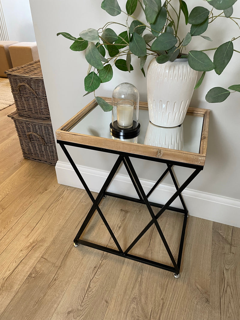 Large cross leg metal table with wooden mirrored top