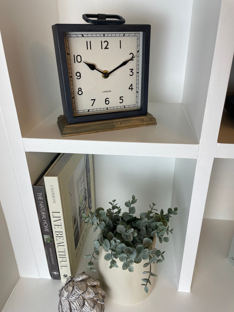 Black wooden based metal clock