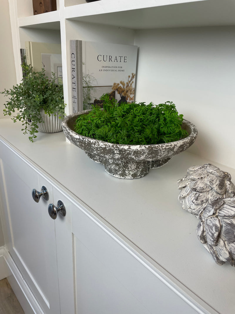 Round rustic stone bowl on foot base