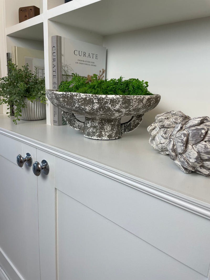 Round rustic stone bowl on foot base
