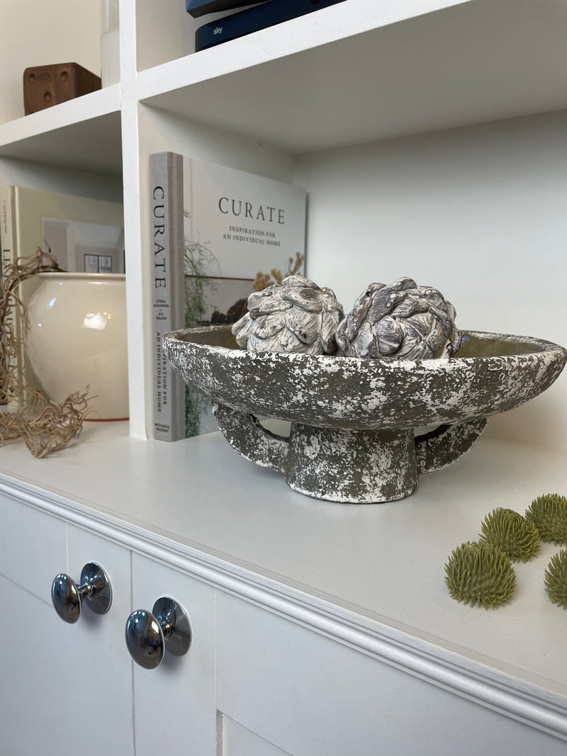 Round rustic stone bowl on foot base