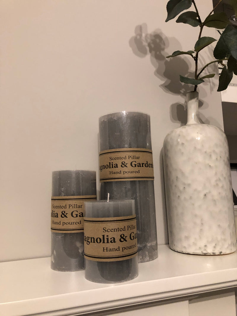 Small scented pale grey pillar candle 10x7cm